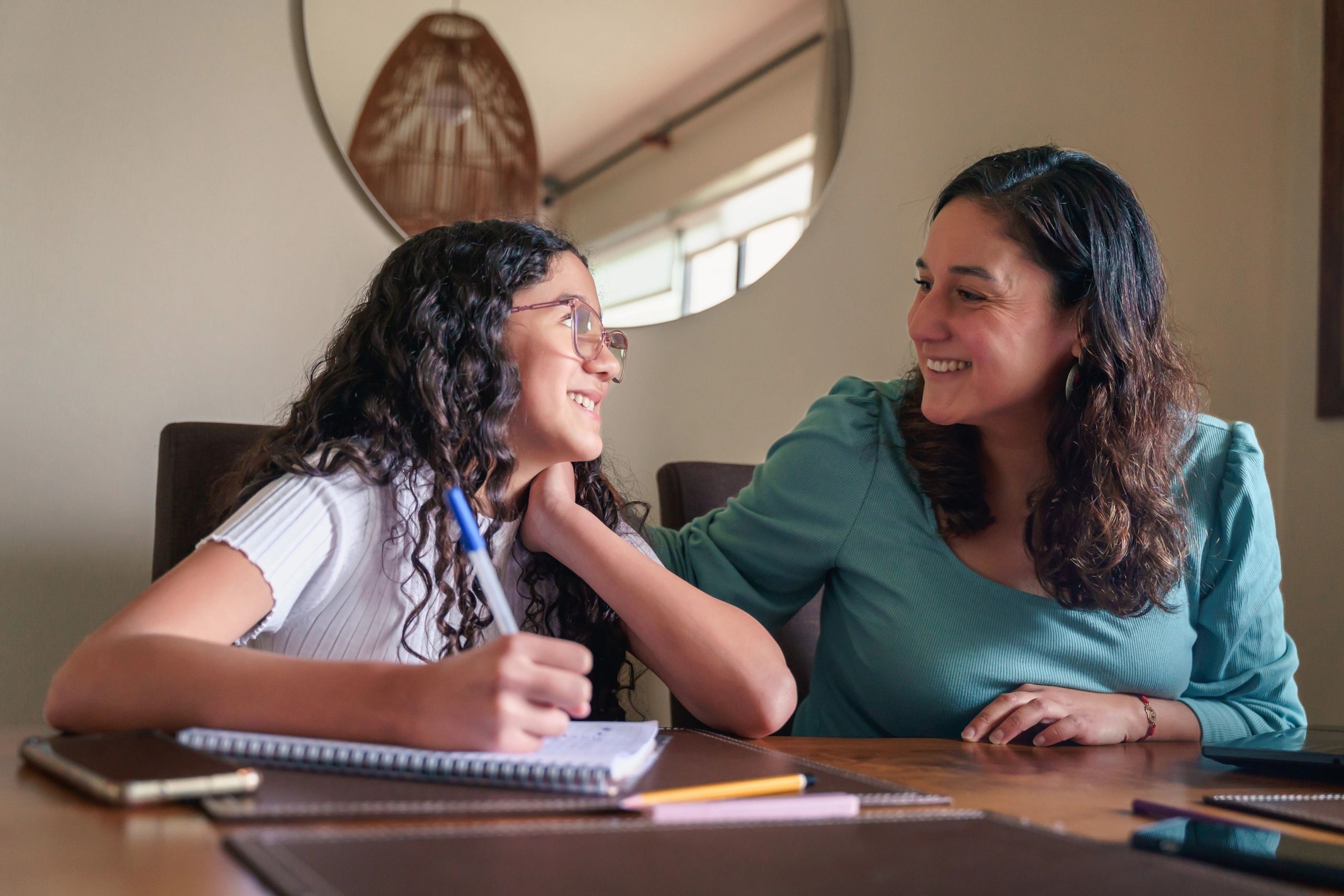 parent supporting teen studying at home